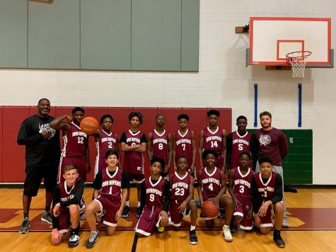 Boys basketball team posing