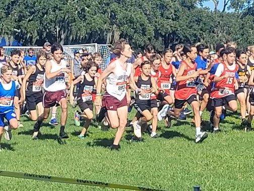 Maverick Plaxton, Carter Penning and Tiger Seth run with the first wave of athletes at a recent meet.