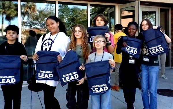 Safety Harbor Middle School students show off their backpacks following a workshop about pathways to college at the Generation Lead Student Leadership Summit. Hundreds of student leaders throughout Pinellas attended the event on the campus of USF-St. Petersburg. 