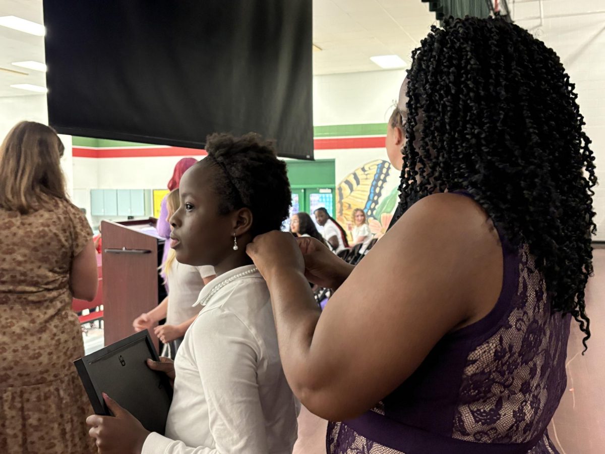 Girlfriends Club member Elle'vai Greene receives her pearls at the induction ceremony on Oct. 17.