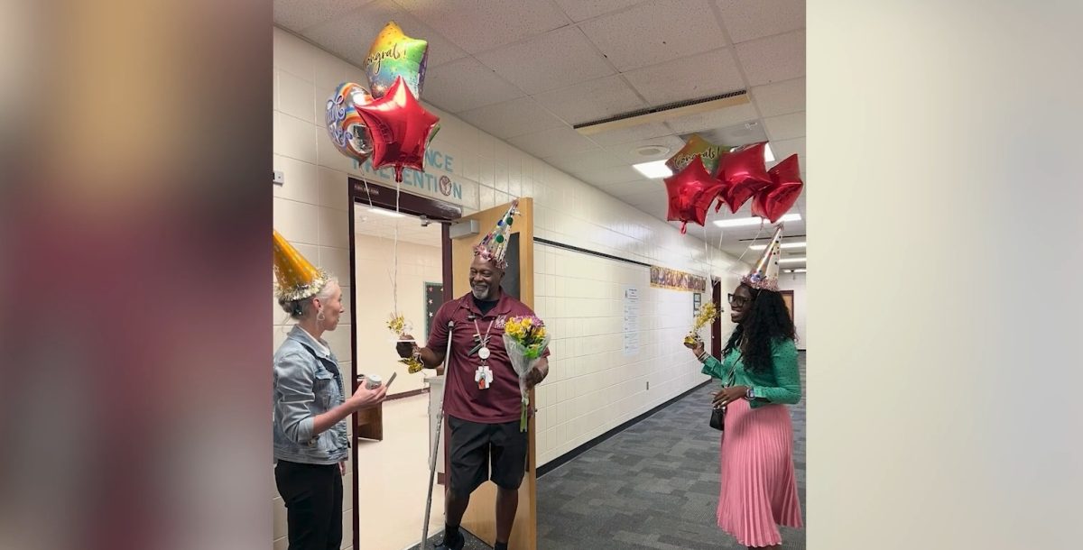 Magnet coordinator Ms. Vongsyprasom and JHop Principal Scott announce Mr. Green as support staff of the year. Image via Ms. Scott