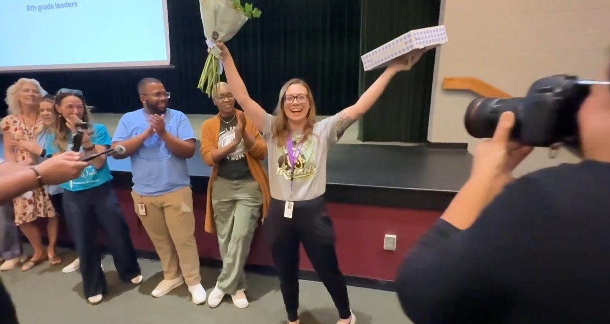 Ms. Guyotte reacts as PCS administrators make the announcement she is a district finalist for teacher of the year.