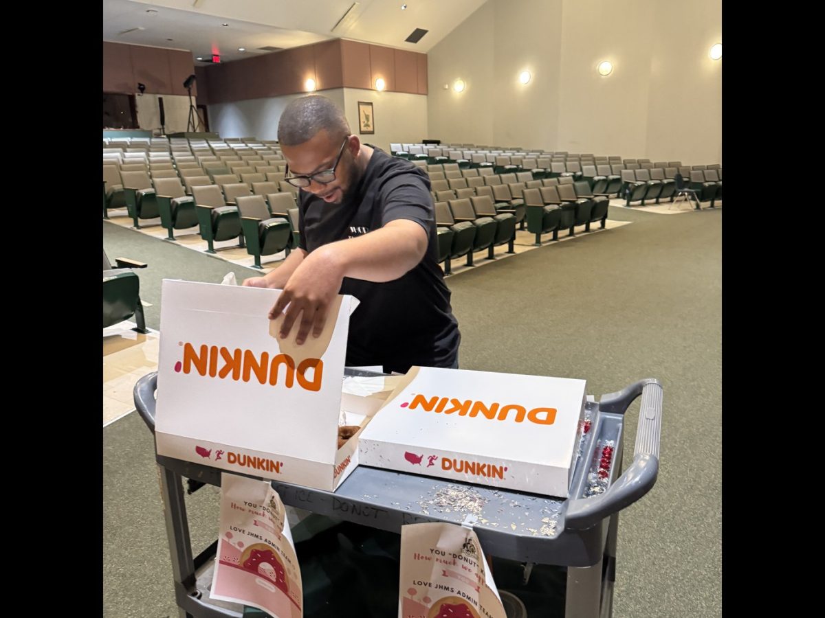 JHop drama instructor Mr. Walker gets his pick of the donuts in appreciation for his hard work.