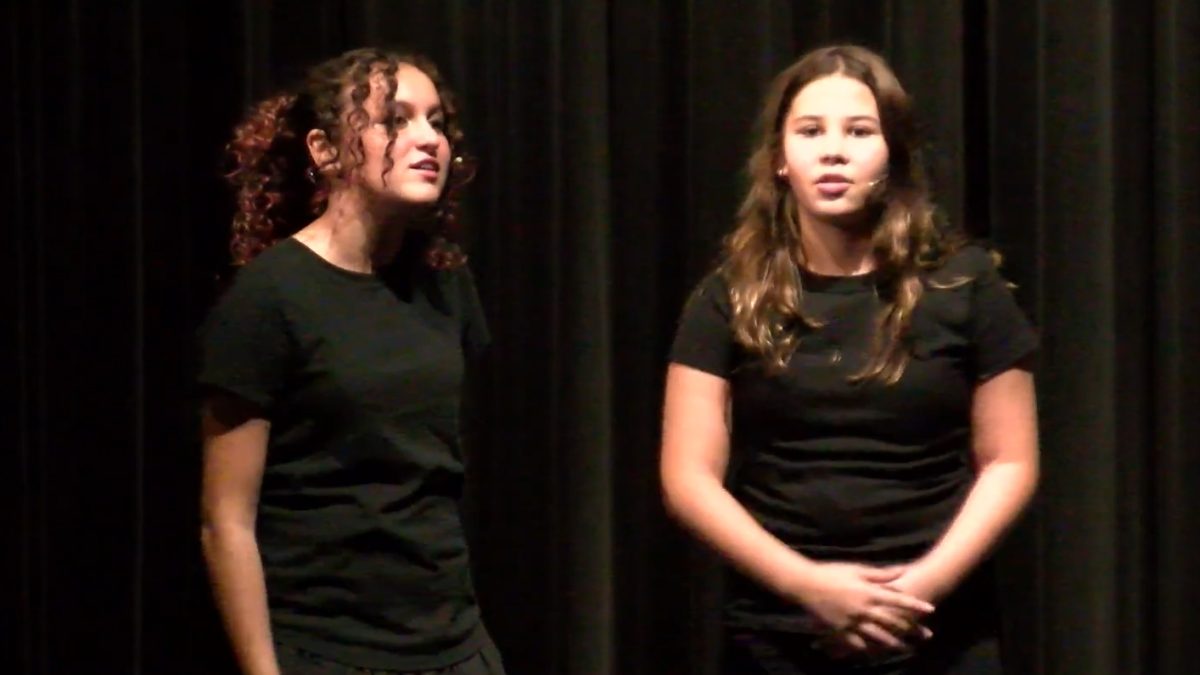 Sixth-grade students Veronica Graham (left) and Scarlett Keller (right) perform at the ITS Candidate Showcase.