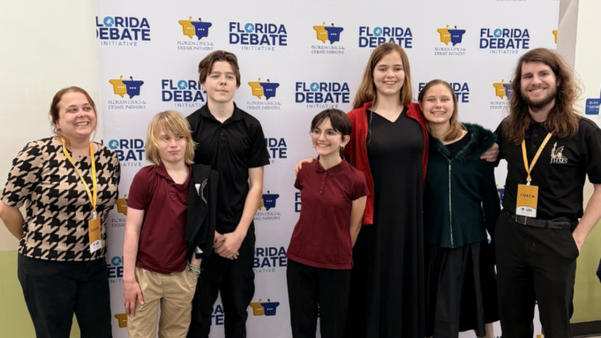 The JHop Speech and Debate team (L-R), Dexter Tas, Conrad Rice, Onyx Weintraub, Sophia Nikkel and Aurora Nikkel with sponsors Crystal Robinson-Fisher and Cameron Lemery.
