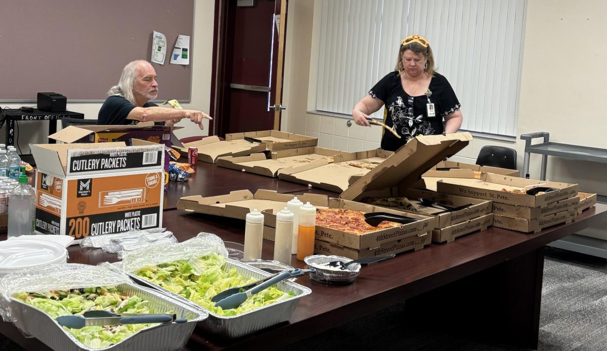 ESE teacher James Shumilak and business teacher Patricia Winegar enjoy the pizza and salad lunch provided by the PTSA.