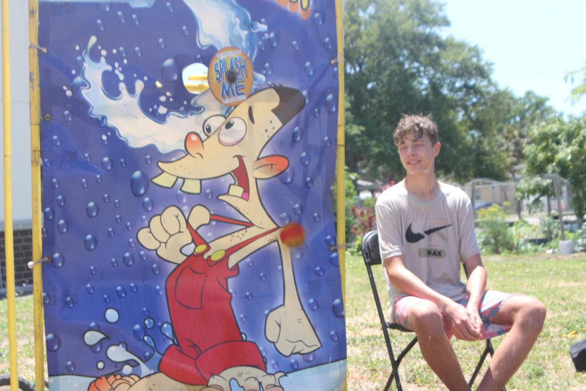 Trojan seventh-grader Alex Engelen awaits another lucky shot to splash him with water.