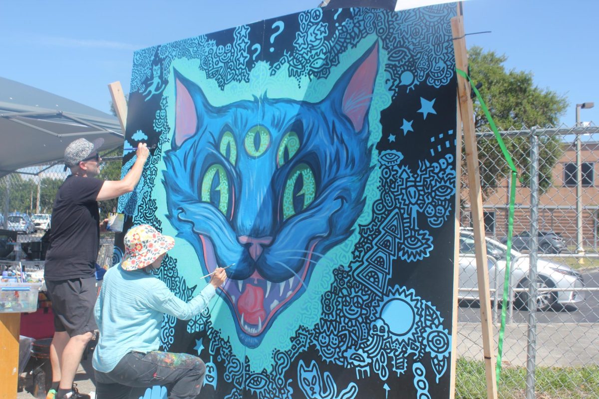 Art battle winners Miss Crit and Chad Mize combine their eclectic styles for a piece that will remain at JHop.