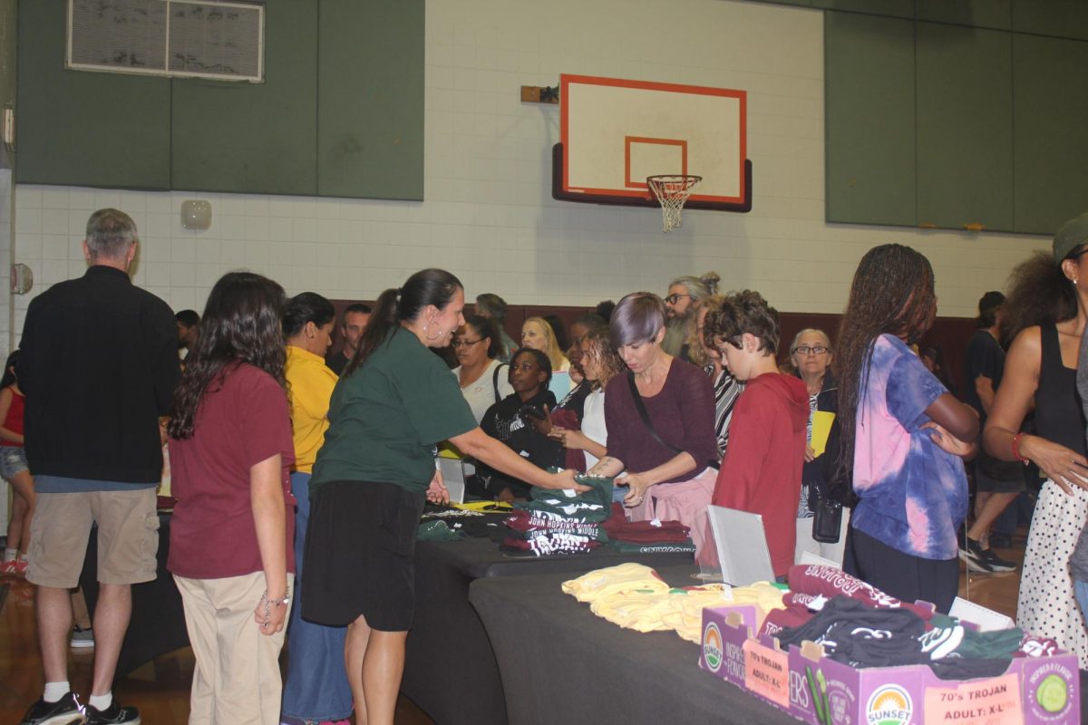 The Spring Expo was held in the JHop gymnasium. New students are seen purchasing Trojan tee shirts for the next school year.